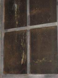 Closeup on an old dirty brown window. 
