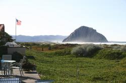 An American flag flies proudly over a patio near Morro Rock.