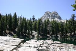 Crystal Crag and broken rocks face off at TJ Lake or Lake Barrett (not sure which). 