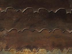 Overlapping rusty saw blades. 