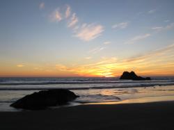 Orange sunset at the beach in Morro Bay. 